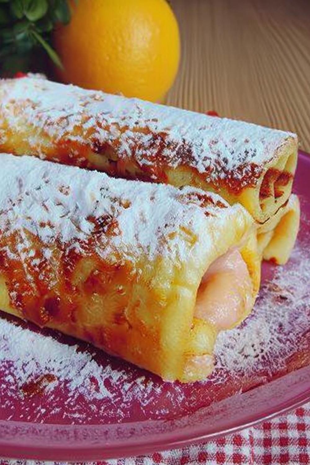 Pannenkoekrolletjes met sinaasappelvulling